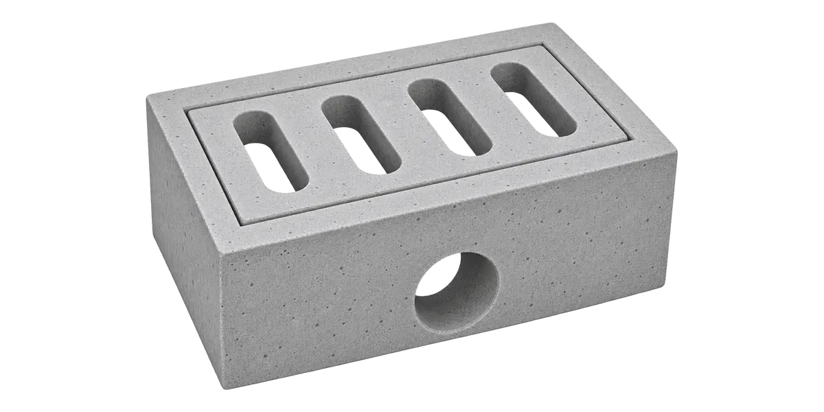 Precast concrete catch pit with a concrete grating and a round outlet